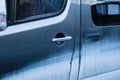 Dirty blue car door. Dirty glass. Royalty Free Stock Photo