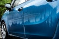 Dirty blue car after rain. Royalty Free Stock Photo