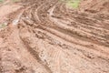 Dirty broken rural road with deep tire tracks. Royalty Free Stock Photo