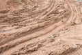 Dirty broken rural road with deep tire tracks. Royalty Free Stock Photo