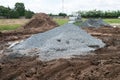 Dirty broken rural road with deep tire tracks. Royalty Free Stock Photo