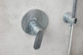 Dirty calcified shower mixer tap, faucet with limescale on it, plaque from hard water, Chrome plated shower, close up