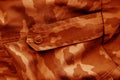 Dirty camouflage cloth in orange tone Royalty Free Stock Photo