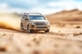 Dirty car on desert highway road. Car trip along desert mountain landscape, tilt-shift style Royalty Free Stock Photo