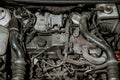 A dirty car engine under the hood Royalty Free Stock Photo