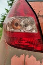 Dirty car tail lights, close up image.