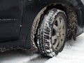 Dirty car tire with snow Royalty Free Stock Photo