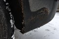 Dirty on car wheel arch in winter. Royalty Free Stock Photo