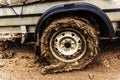 Dirty car wheel. Lack of paved roads. Close-up