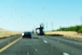 Dirty car window glass with insects and dirt affect driver visibility while driving on divided highway. The worn out or bad car Royalty Free Stock Photo