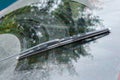 Dirty car window with a wiper blade Royalty Free Stock Photo