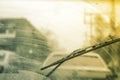 Dirty car windshield with the included glass cleaner, in the big city front and back of the background is blurred