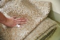 Dirty carpet soaking in special chemical solution in carpet cleaning service