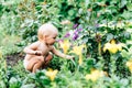 A child with blue eyes is playing in the village in the summer