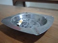 Dirty cigarette ashtray on the table Royalty Free Stock Photo