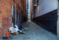 Dirty city alley with garbage. Municipality sanitation and public health