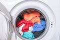 Dirty clothes are inside the washing machine. Automatic washer with open door. Erasing home t-shirts Royalty Free Stock Photo