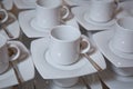 Dirty coffee cup and spoon setting on white saucer and wooden table after drinking in the morning in vintage style Royalty Free Stock Photo