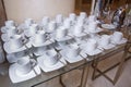 Dirty coffee cup and spoon setting on white saucer and wooden table after drinking in the morning in vintage style Royalty Free Stock Photo