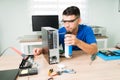 Professional technician using compressed air Royalty Free Stock Photo