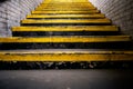Dirty concrete staircase with yellow lines