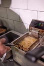 Dirty cooking area with french fries deep fryer. Royalty Free Stock Photo