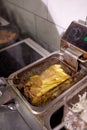 Dirty cooking area with french fries deep fryer. Royalty Free Stock Photo