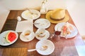 Dirty cups and plates on the table after dinner. Leftovers the food in the hotel, all inclusive