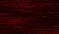 Dirty dark horror red wooden surface with mystery scratched grey messy dark parts. Grunge wood