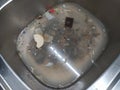 Dirty dishes in the kitchen sink clogged. Complete mess