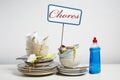 Dirty dishes pile needing washing up on white background Royalty Free Stock Photo