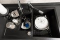 Dirty dishes in the sink in the kitchen top view Royalty Free Stock Photo