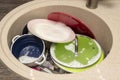 Dirty dishes in the sink. Unwashed dishes and utensils in a kitchen sink. Washing dishes concept Royalty Free Stock Photo