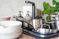 Dirty dishes and unwashed kitchen appliances filled the kitchen sink Royalty Free Stock Photo