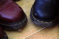 Dirty Dr Martens boots. Leather shoes, Dr. Martens, dirty and muddy. Vintage, classic, punk, fashion design.