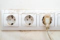 dirty dust on the power socket or connector and electric wire in the room. real old neglected dusty dirt on the electrical compute