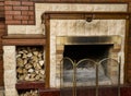 Dirty empty fireplace with firewood