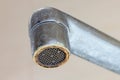 Dirty faucet aerator with limescale, calcified shower water tap with lime scale in bathroom, close up Royalty Free Stock Photo