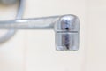 Dirty faucet aerator with limescale, calcified shower water tap with lime scale in bathroom, close up Royalty Free Stock Photo