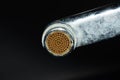 Dirty faucet aerator with limescale, calcified shower water tap with lime scale in bathroom, close up Royalty Free Stock Photo