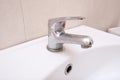 Dirty faucet with limescale, calcified water tap with lime scale on washbowl in bathroom, home cleaning concept