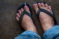 Dirty feet of a man wearing sandal Royalty Free Stock Photo