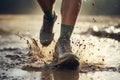 Dirty feet runner run trail in autumn through mud and puddles