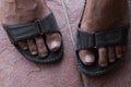 Dirty feet in sandals Royalty Free Stock Photo