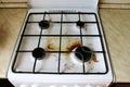 Dirty gas stove with food debris and grease stains. A dirty gas stove with grease stains, old grease stains, frying Royalty Free Stock Photo
