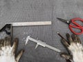 Dirty Gloves and Vernier in workshop,Mechanic equipment Royalty Free Stock Photo