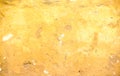 Dirty gold yellow concrete wall with cracked and peeling texture on  background Royalty Free Stock Photo