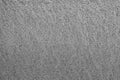 Dirty gray full-frame background with uniform grainy texture