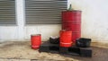 Dirty greasy barrels outside building with grease barrels. Royalty Free Stock Photo