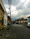 Dirty street in Bogota with mountains
